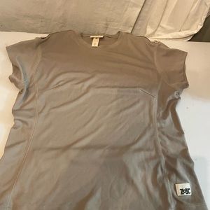 ZOIC women’s cycling tan polyester cap sleeve top with zip close pocket on back